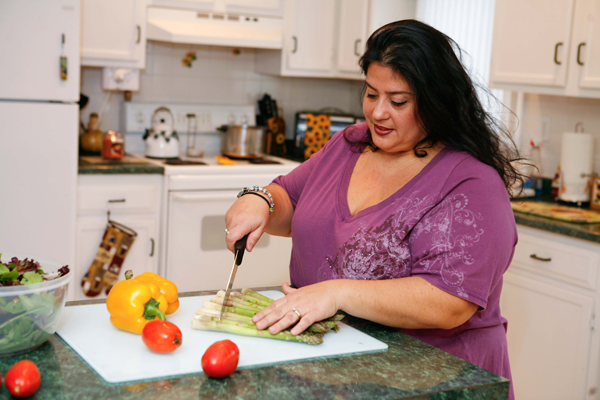 Plus size woman preparing health food