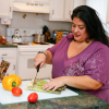 Plus size woman preparing health food